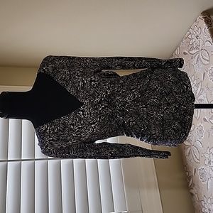 Ladies 3/4 sleeve top.  Gathered at midsection.  Very flattering.